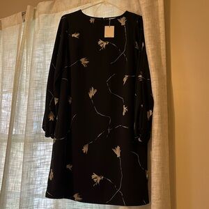 Pretty black long sleeve dress with keyhole button back, white abstract floral